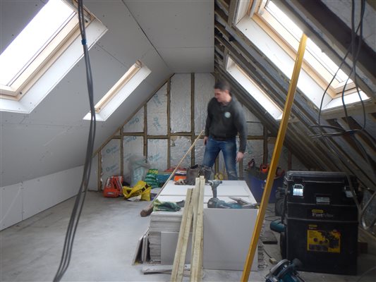 Plasterboard being fitted in Shepherds Bush