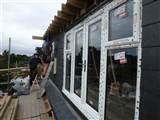 Hip to gable roof extension with rear dormer and full reroof in Spanish slates in West Ealing W13