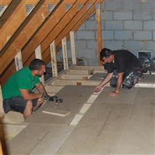 Aron and Eddie fitting chipboard flooring on this loft conversion