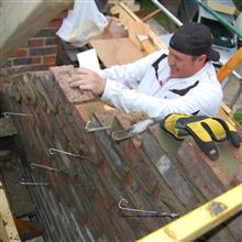 Aaran bricking up a gable end on a loft conversion