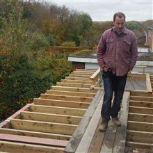 Claudiu fitting the flat roof joists.