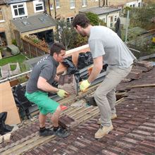 Hayden and Billy stripping the back roof at the loft conversion in Ealing