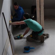Hayden and Dylan plasterboarding at our current loft conversion in Ealing