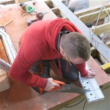 Anthony here from Ash Island Lofts cutting PVC window boards whilst fitting windows as a loft conversion in Feltham, TW14.