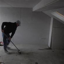 Paul from Ash Island lofts sweeping up and keeping the site tidy