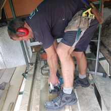 Locky cutting timber at our recent Wimbledon SW19 loft conversion.