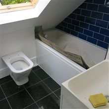 Making use of all the space with the bath fitting in under the eaves on this loft conversion in Chiswick.