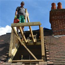 Hayden building a pitched roof dormer.