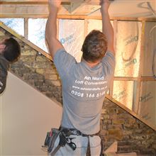 Billy of Ash Island Lofts plaster boarding the ceiling in loft conversion in Chiswick W4