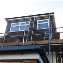 Boxed dormer with hanging tiles in Feltham by Ash Island Lofts of Chiswick.