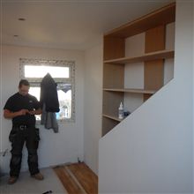 Aaron from Ash Island Lofts building custom fitted cupboards to loft conversion in Ealing West London