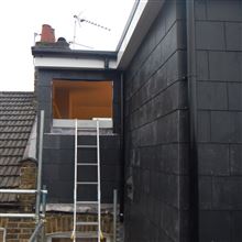 L Shaped dormer conversion in Chiswick W4 in slate ready for timber sash window to be fitted