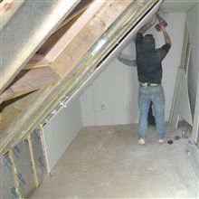 Plasterboarding at a loft conversion in High Wycombe.