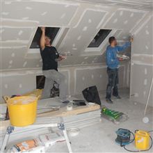 Dorin and Stefan tape and jointing at this dormer loft conversion in Brentford.