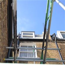 Mansard loft conversion in Shepherds Bush W12 with leaded dormers and Spanish slate tiles by Ash island Lofts