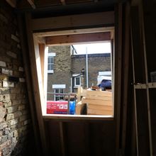 Mansard timber casement window over the stairwell in SW6 7JZ